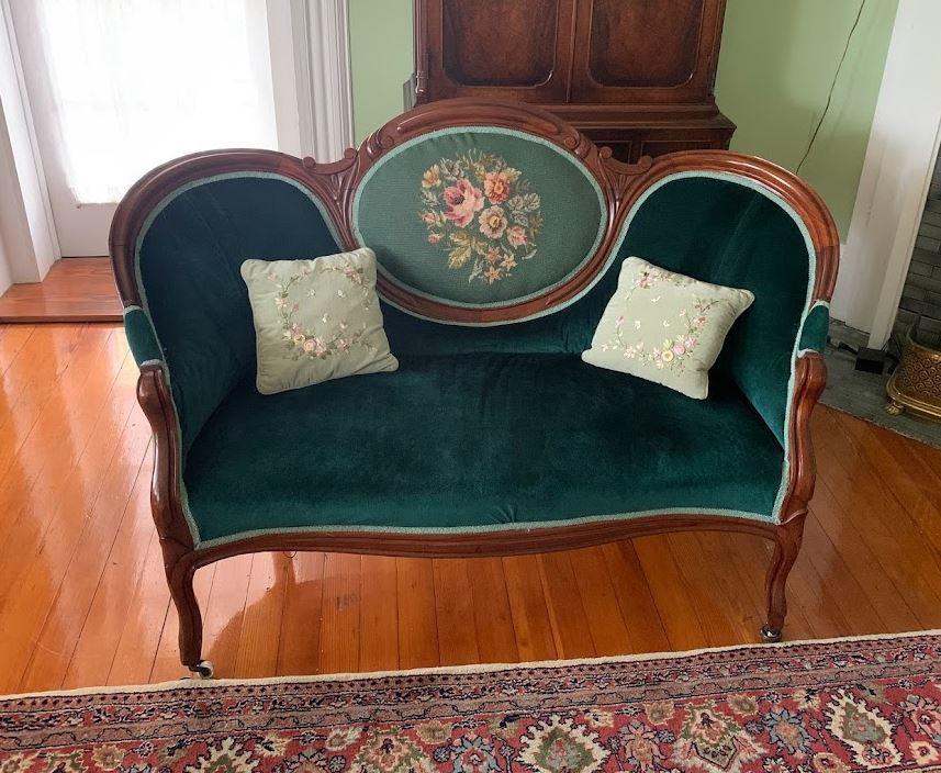 Antique Victorian love seat in green velvet and needpoint